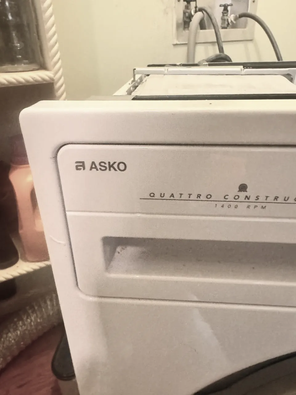 ASKO washing machine detergent drawer and control panel close upASKO washer front panel and detergent drawer close-up