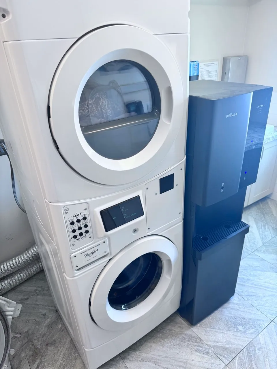 Commercial Whirlpool stacked washer and dryer unit