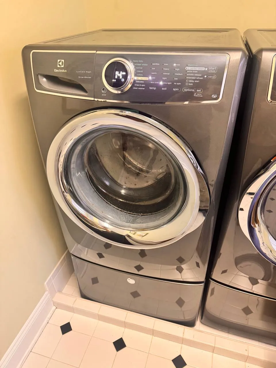 Electrolux front load washing machine in home laundry area
