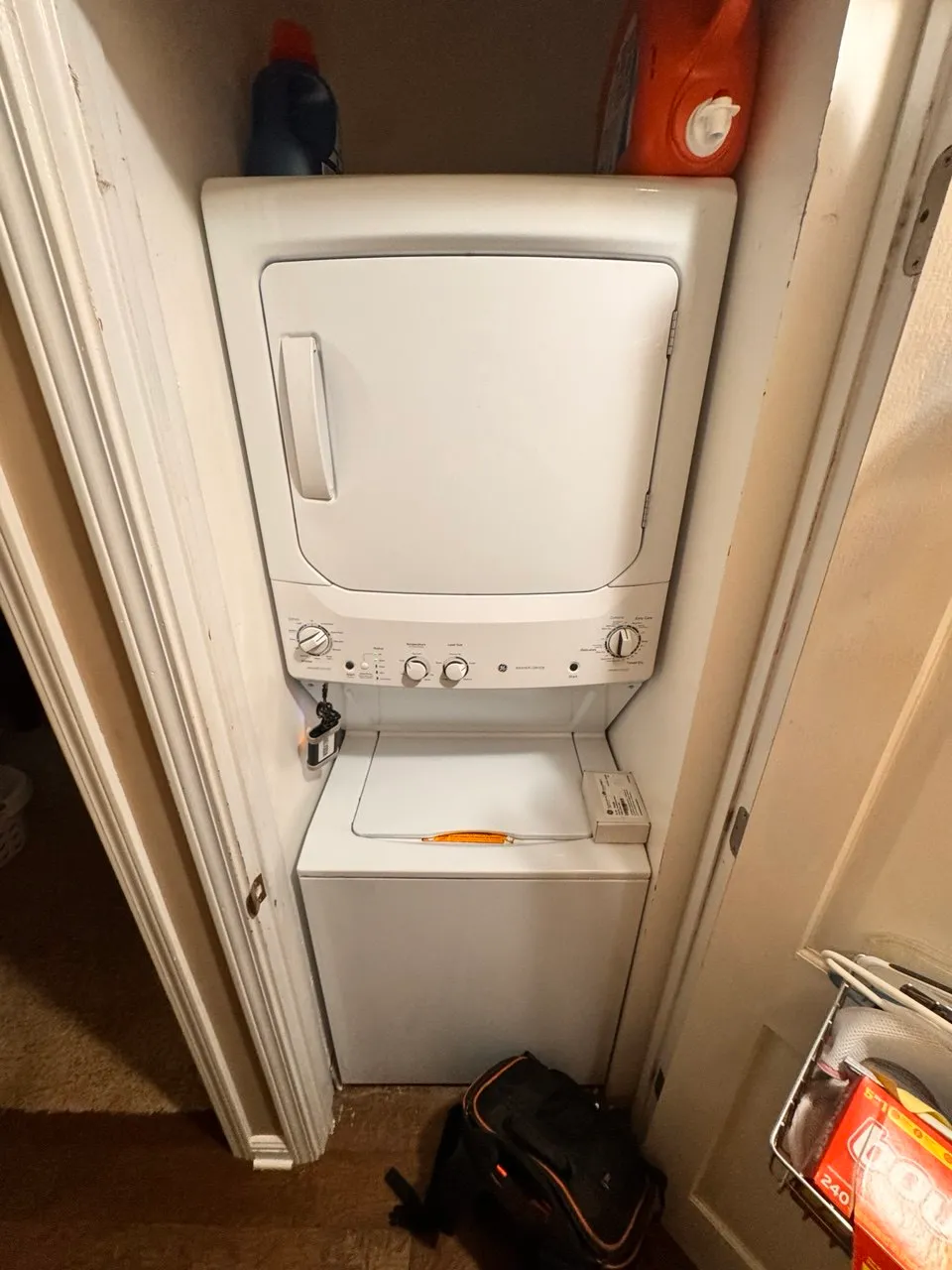 Compact GE washer and dryer combo installed in closet