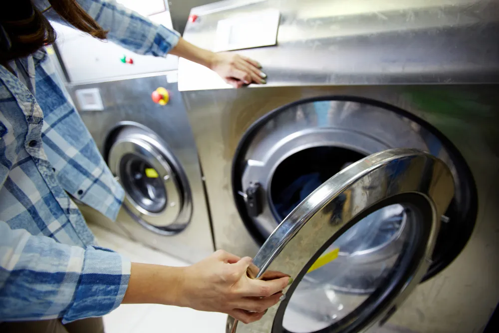 Opening door of front load commercial washing machine