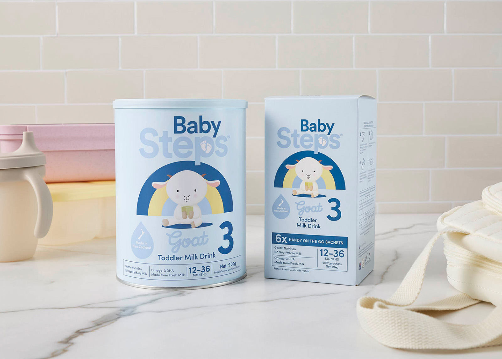 Baby Steps brand goat milk toddler milk drink for ages 12-36 months in can and box packaging.