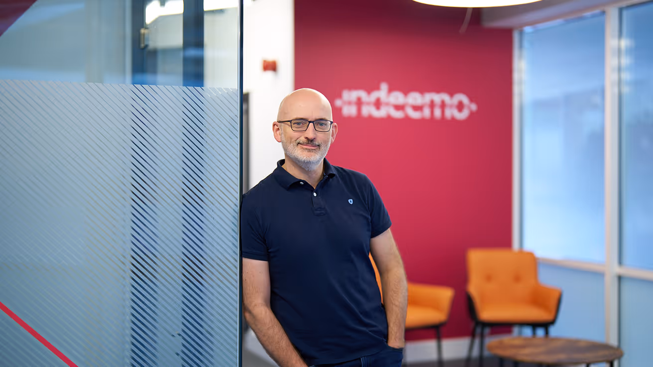 Eugene Murphy, CEO at Indeemo, standing in office.