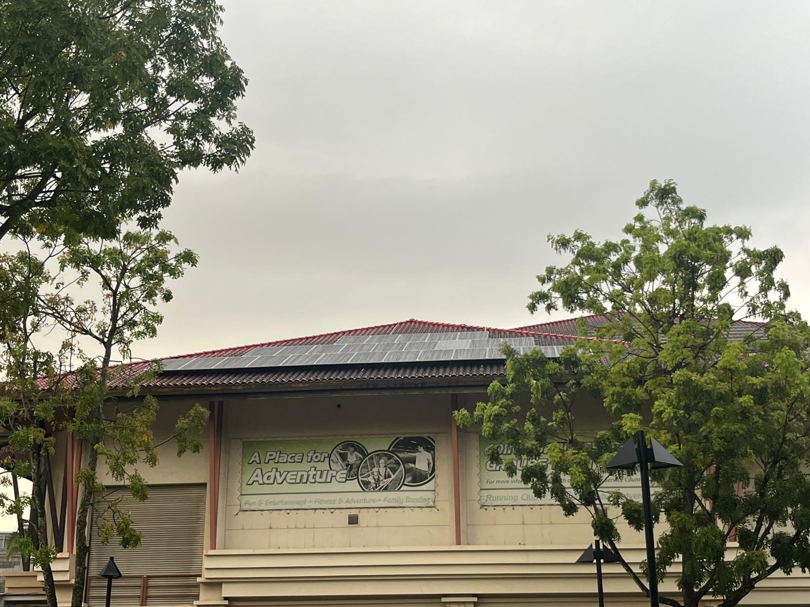 A Singapore landed home under an overcast, cloudy sky, illustrating that solar panels still generate on cloudy and rainy days.