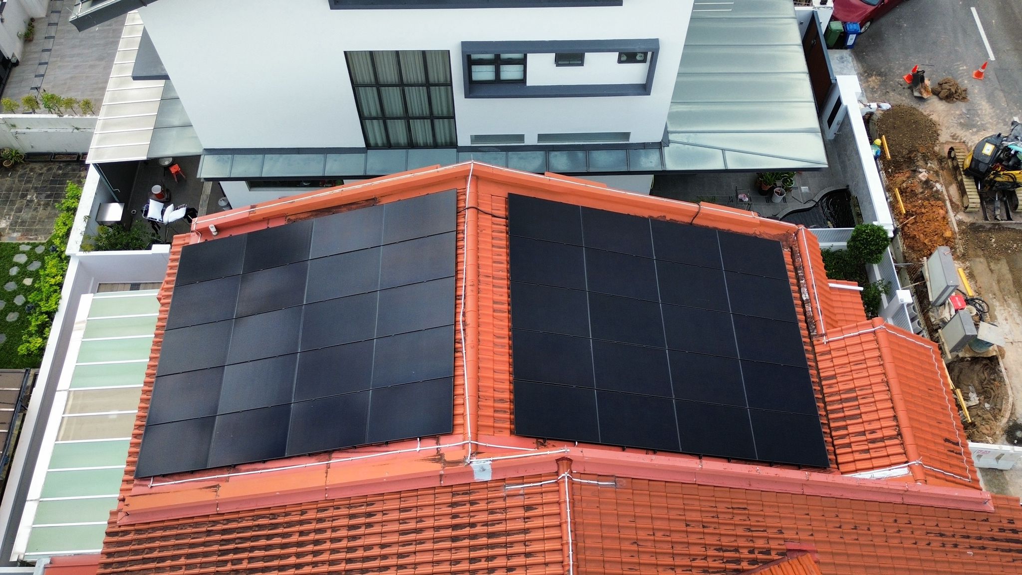 Solar panels installed on a landed-home roof in Singapore by Rezeca Renewables, illustrating tile, metal and RC roof mounting