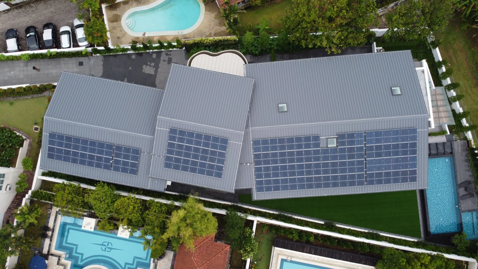 60.3 kWp residential solar system on a standing seam metal roof GCB at Garlick Avenue, Bukit Timah. Three-array layout saving S$22,500 yearly. Commissioned 2022 by Rezeca.