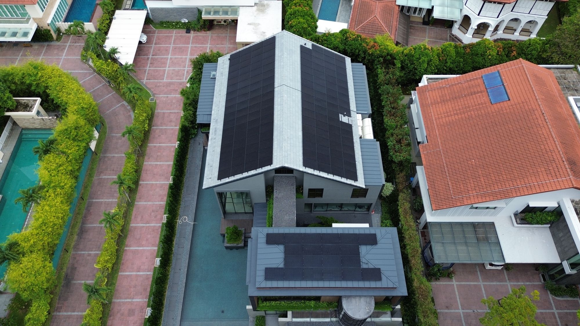 Premium all-black solar panels on a Singapore landed home, comparing Aiko, Trina and other leading 2026 panel brands