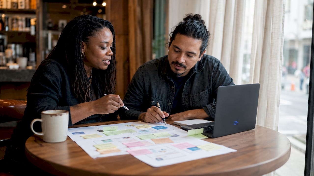 Account managers reviewing client project briefs