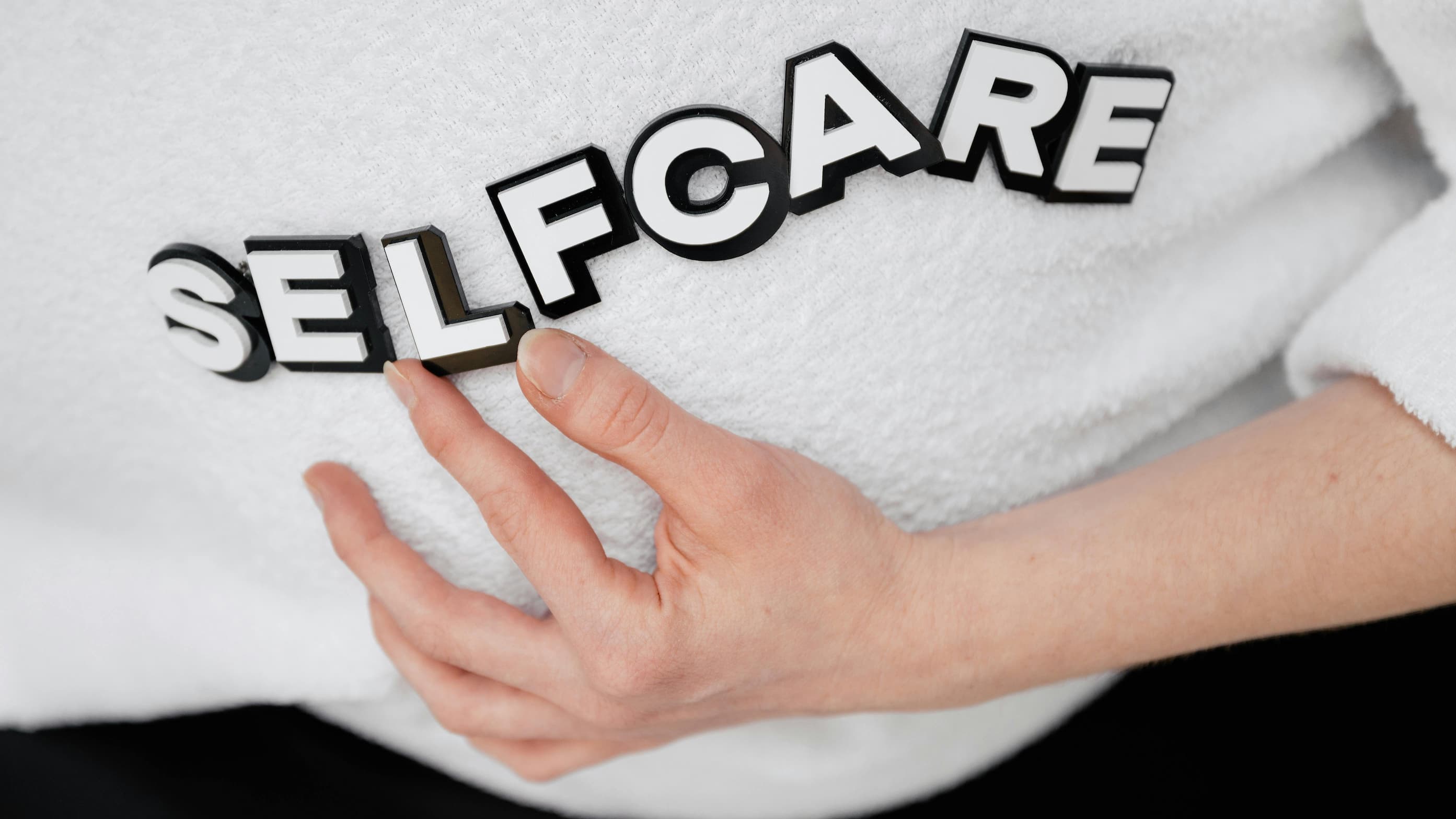 Person practicing self-help strategies for OCD management between therapy sessions