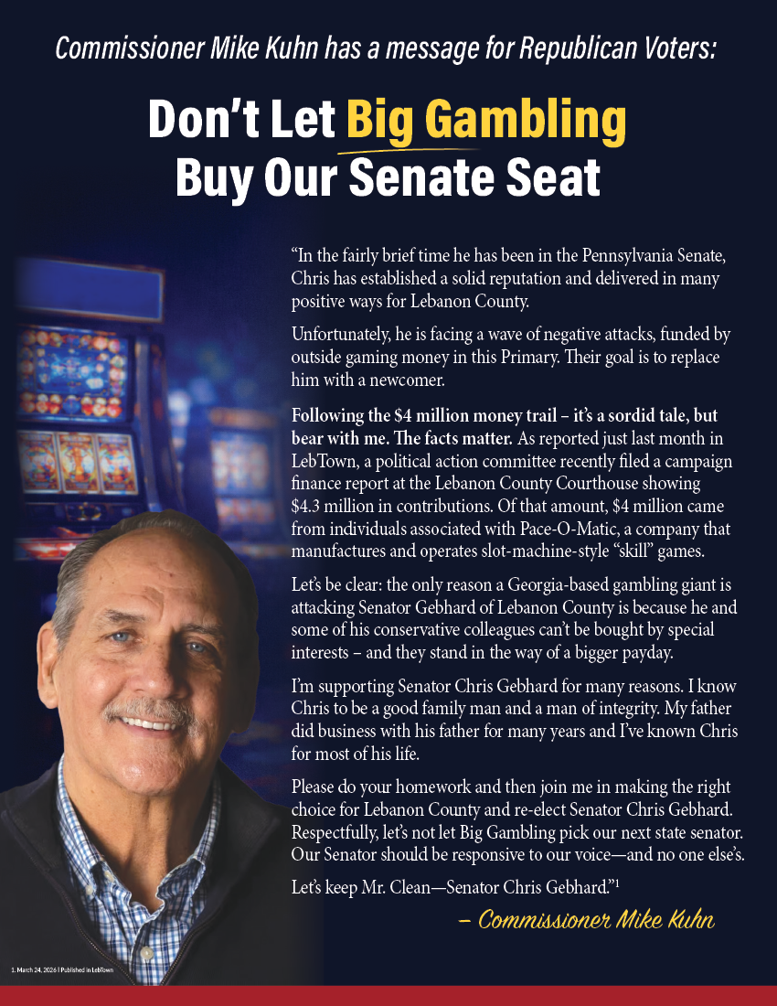 Commissioner Mike Kuhn next to a message urging Republican voters not to let big gambling influence the Pennsylvania Senate seat, supporting Senator Chris Gebhard.