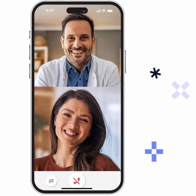 Video call on a smartphone showing a smiling man in a white coat and a smiling woman with long dark hair.