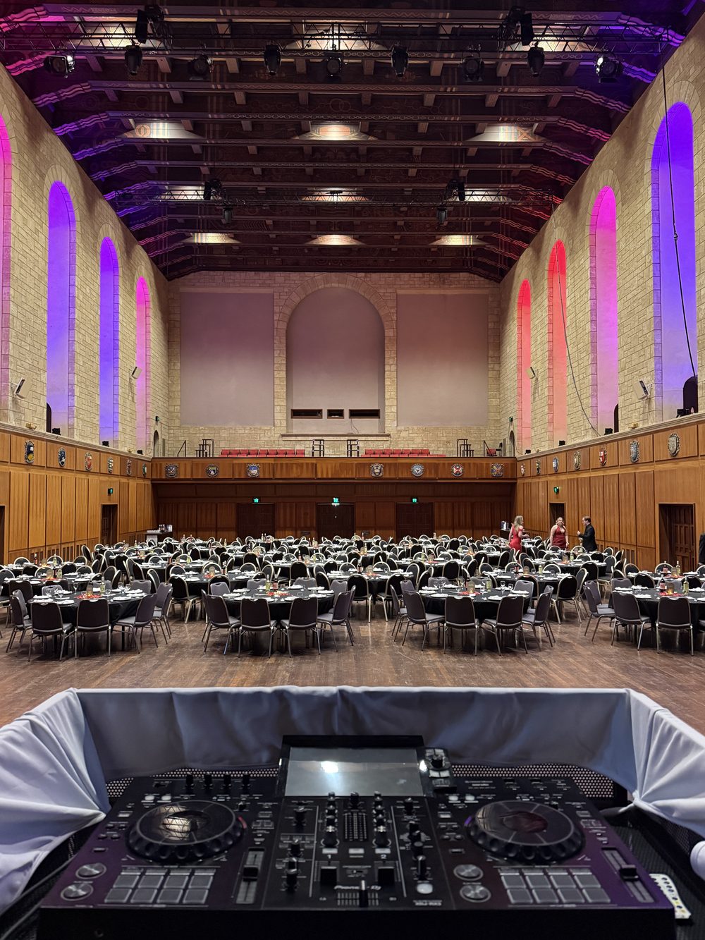 DJ booth set up and sound-checked before guests arrive at a university ball in Winthrop Hall, UWA, Perth