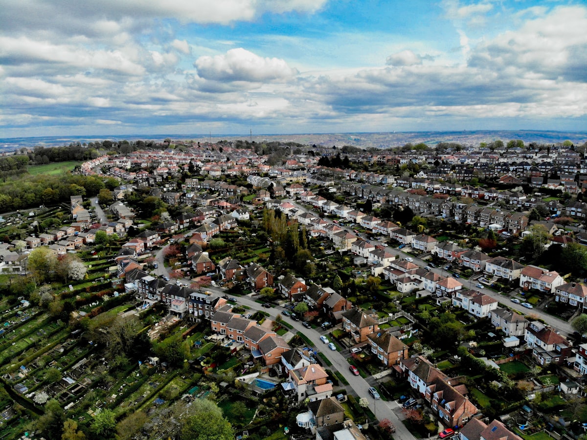 Aerial view of residential buildings and land in a growing Nigerian city