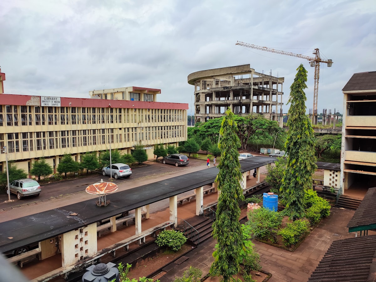 Infrastructure development in Nigeria showing a train passing a building under construction