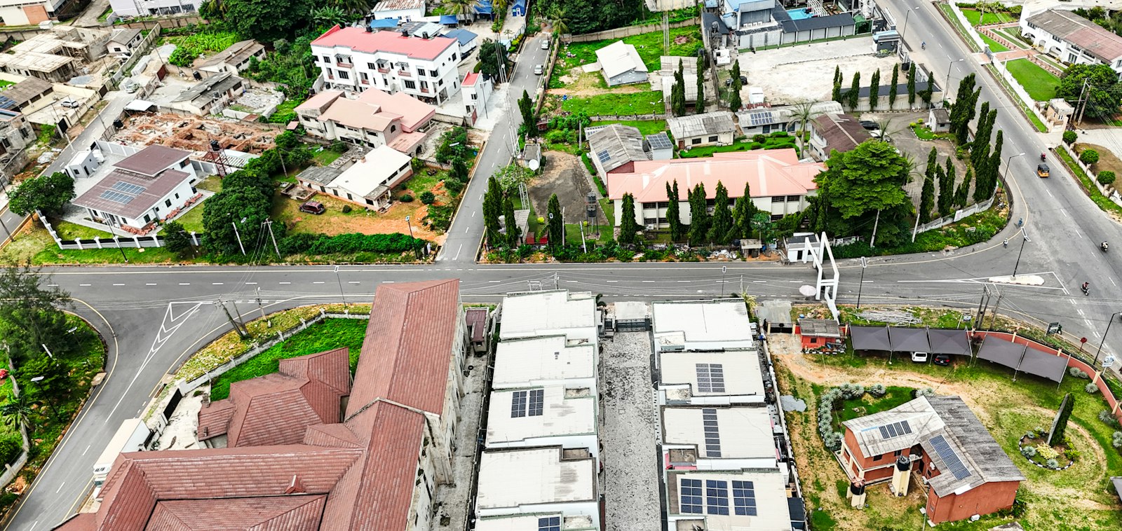 Aerial view of residential development along a Nigerian road corridor