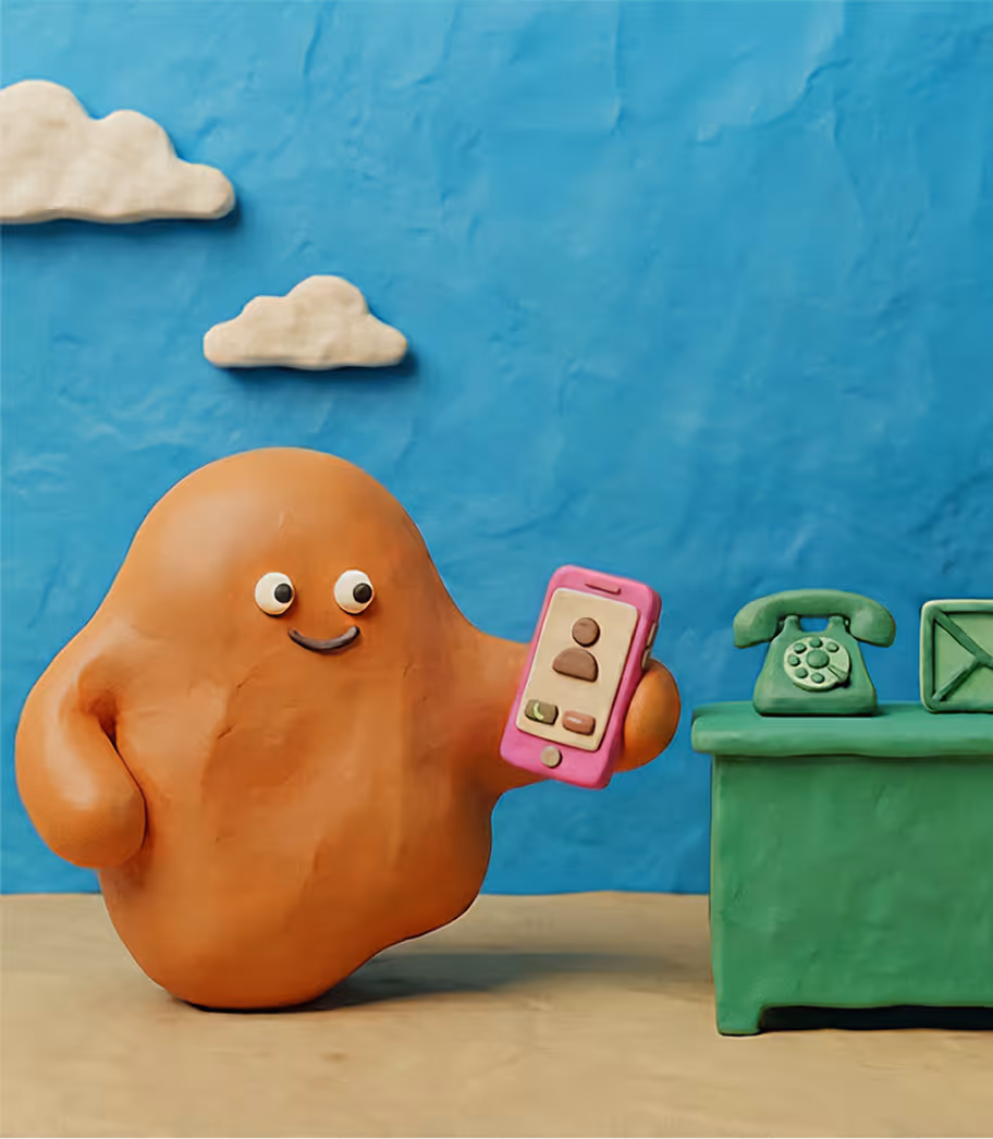 Claymation character holding a pink smartphone showing a contact screen, standing next to a green desk with a vintage telephone and an envelope icon on a blue background with clay clouds.