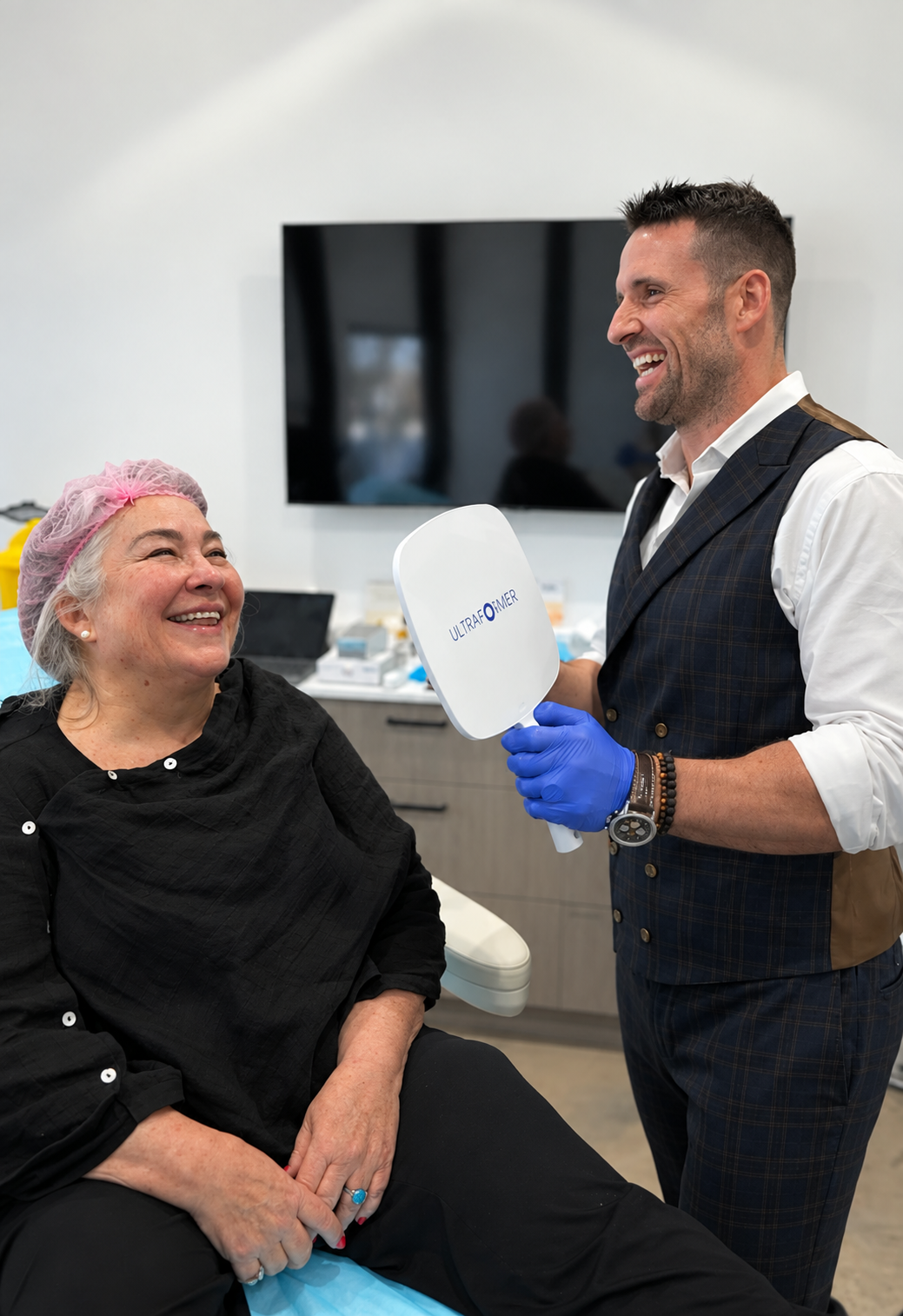Dr Jonathan Hopkirk discussing cosmetic medicine with client.