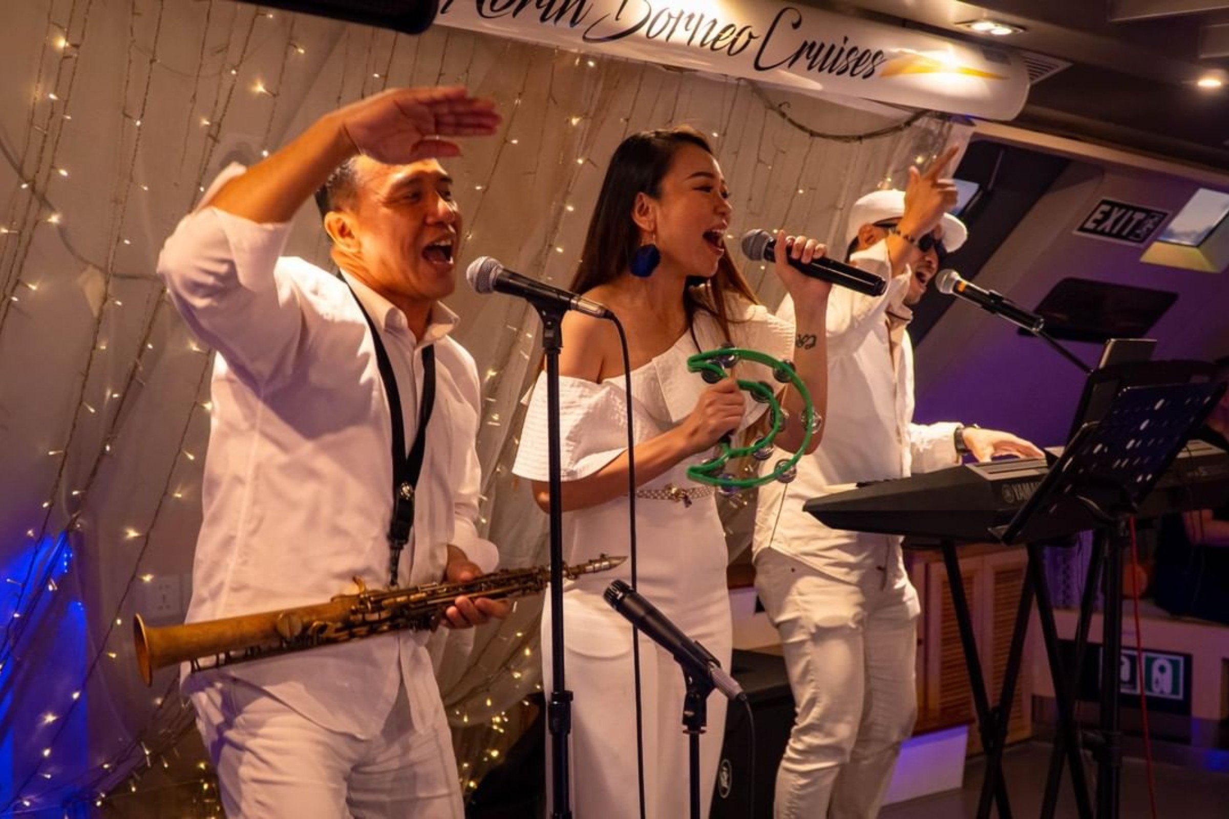 Live band performing on stage in North Borneo Cruise.