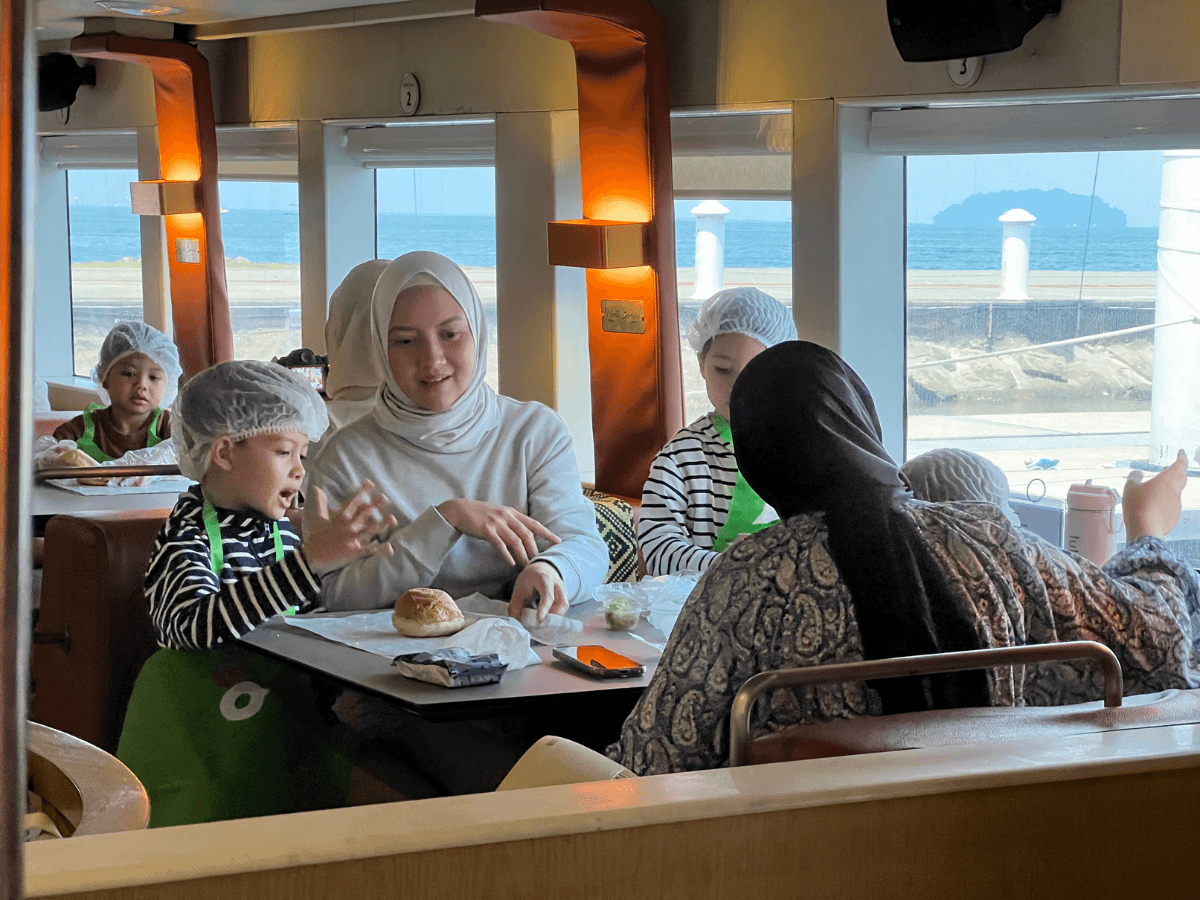 Kids get hands-on making their own Borenos burgers aboard North Borneo Cruises