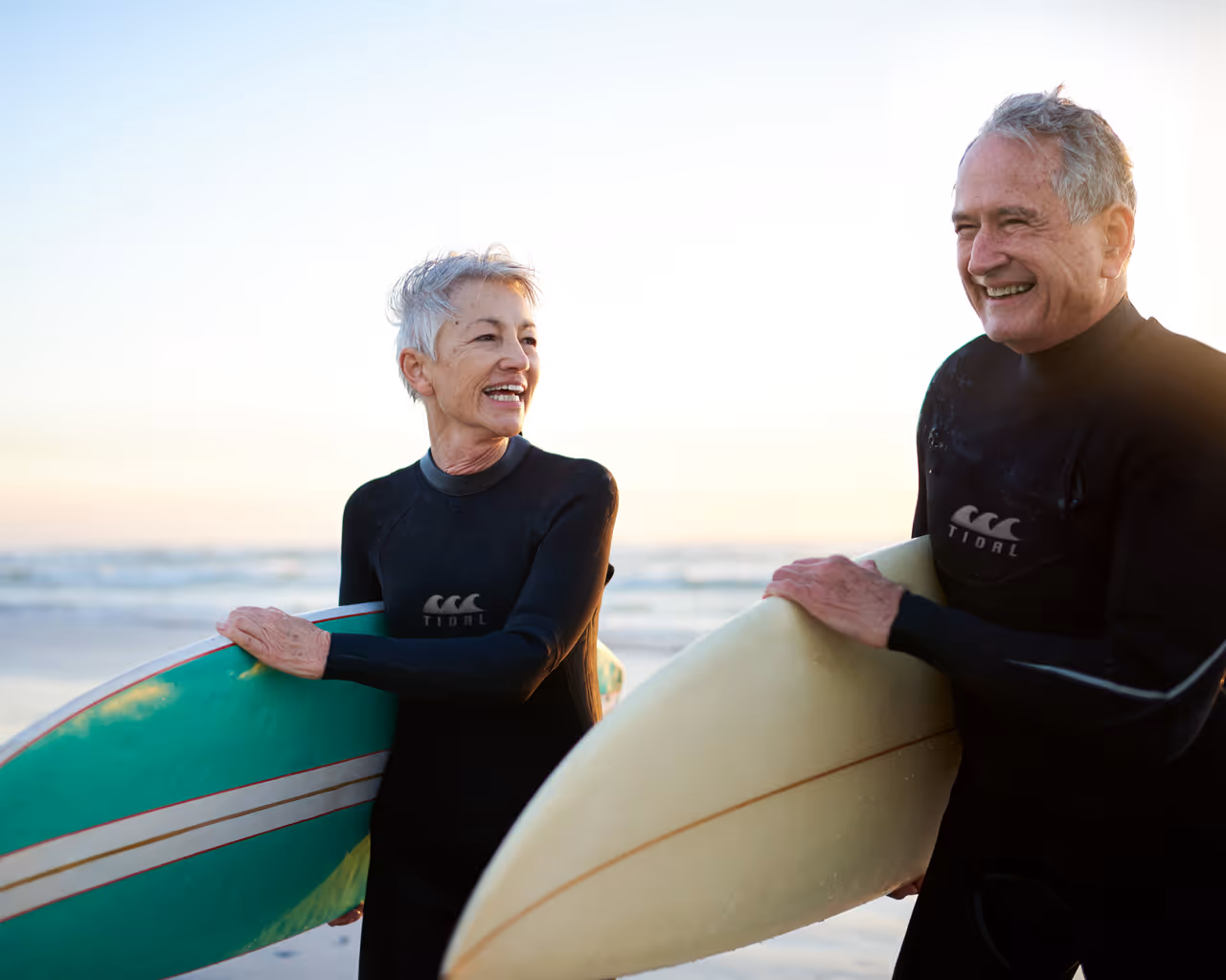 Cropped shot of a senior married couple coming from surfing