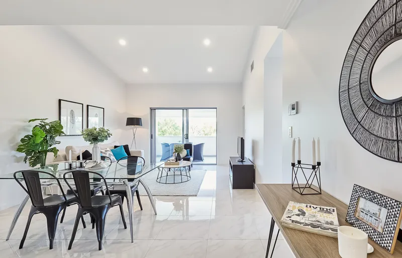 Staged Brisbane living room with contemporary decor and warm natural light
