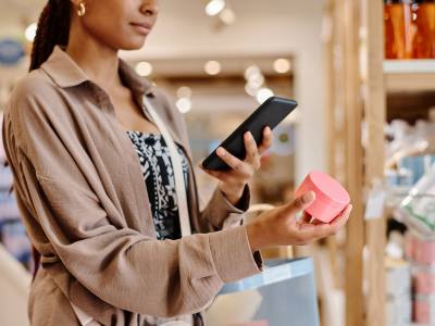 woman taking photo of product in store