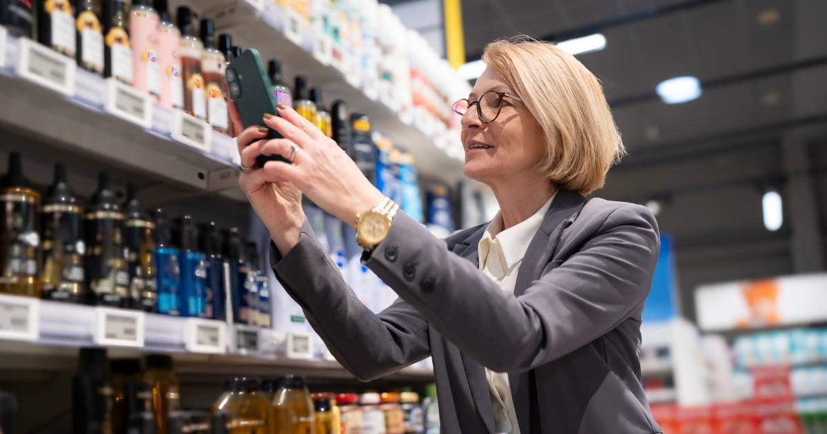 Woman taking photo in store