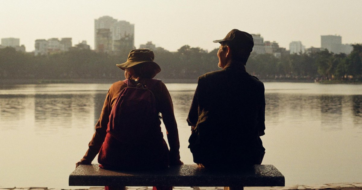 Couple sitting at bench