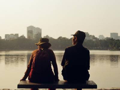 Couple sitting at bench