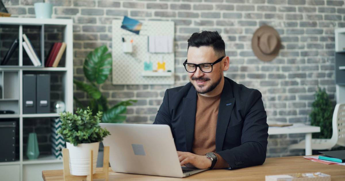 A researcher reviewing participant submissions across multiple research tools on a laptop.