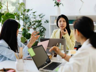 A research ops lead reviewing live study dashboards across multiple research projects.