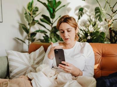 woman talking to camera smartphone living room