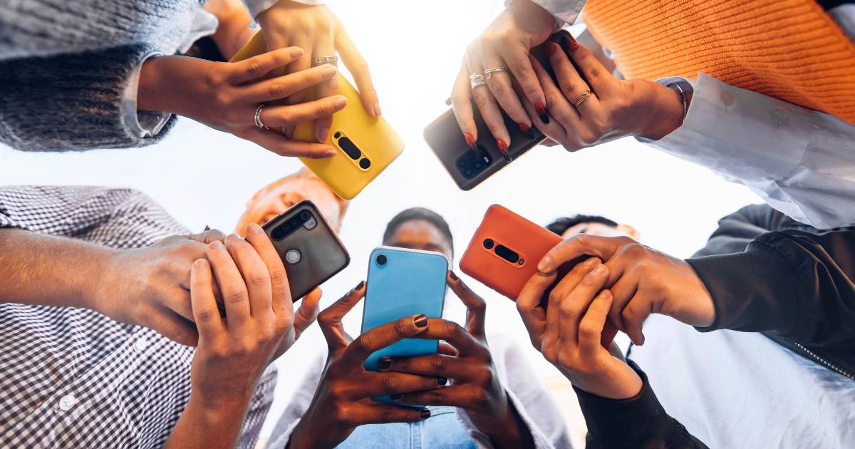 Group of people using smart phones.