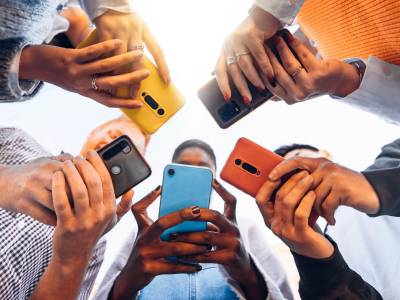 Group of people using smart phones.