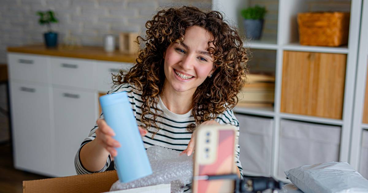 A participant using a product prototype in their home context as part of a human factors research study.