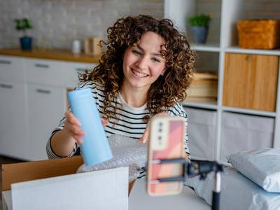 A participant using a product prototype in their home context as part of a human factors research study.