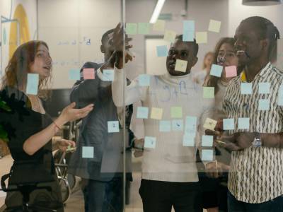 A product team reviewing continuous discovery research findings from customers.