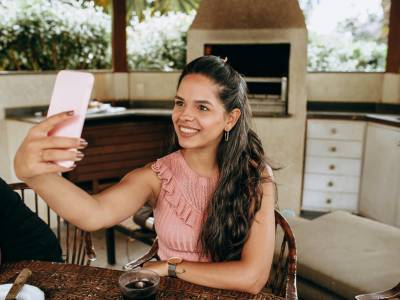 Young Woman Taking a Selfie Outdoors