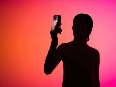 Holo AI Silhouette of Person with Smartphone.