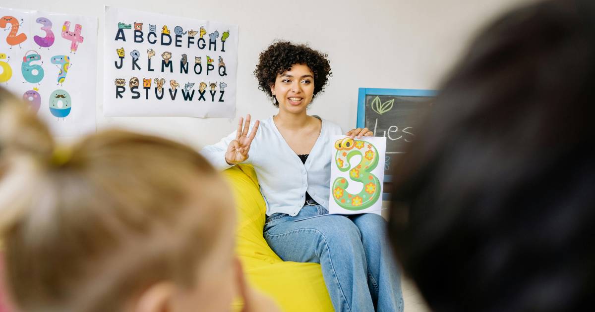 A Woman Teaching Kids.