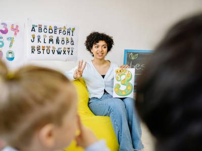 A Woman Teaching Kids.