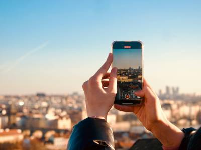 Capturing City Skyline with Smartphone at Sunset
