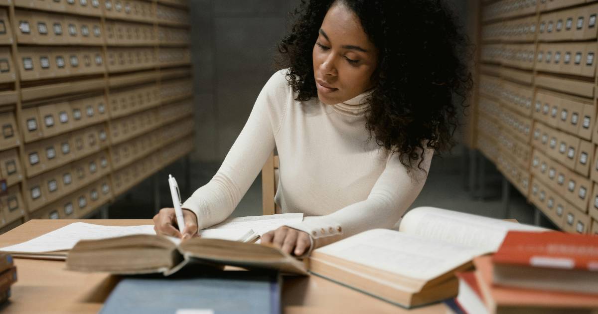 A Woman Researching in the Library.