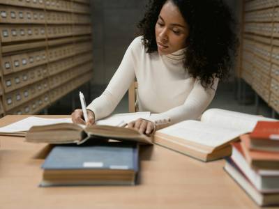 A Woman Researching in the Library.