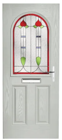 Light grey door with an arched stained glass window featuring red and green floral design and a mail slot below.