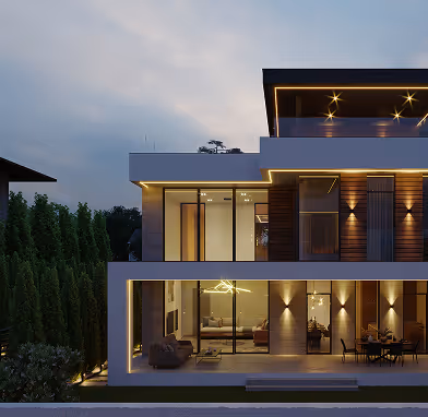 Modern multi-level house exterior at dusk with illuminated windows and outdoor lighting.