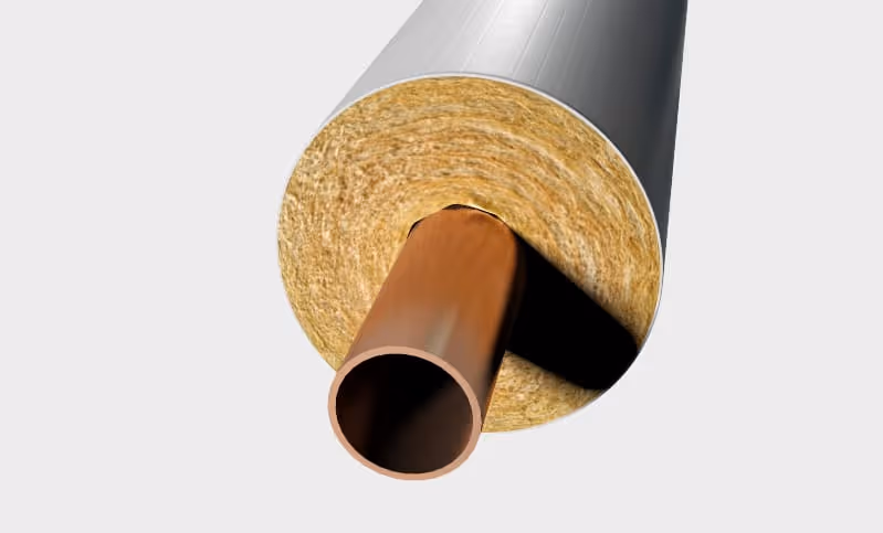 Cross-section of a pipe with brown insulation material wrapped around it inside a gray outer casing.