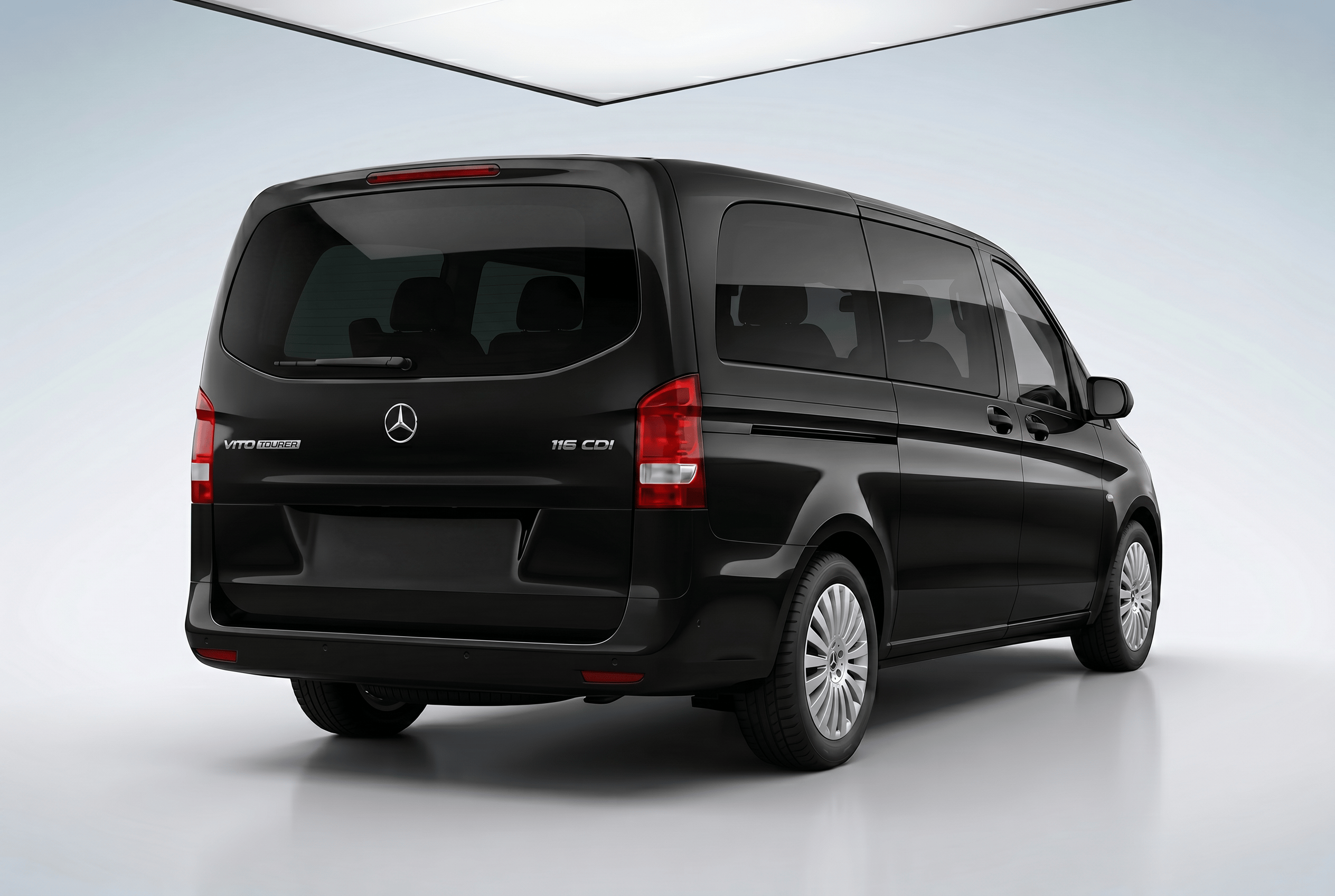 Rear side view of a black Mercedes-Benz Vito van on a white background.