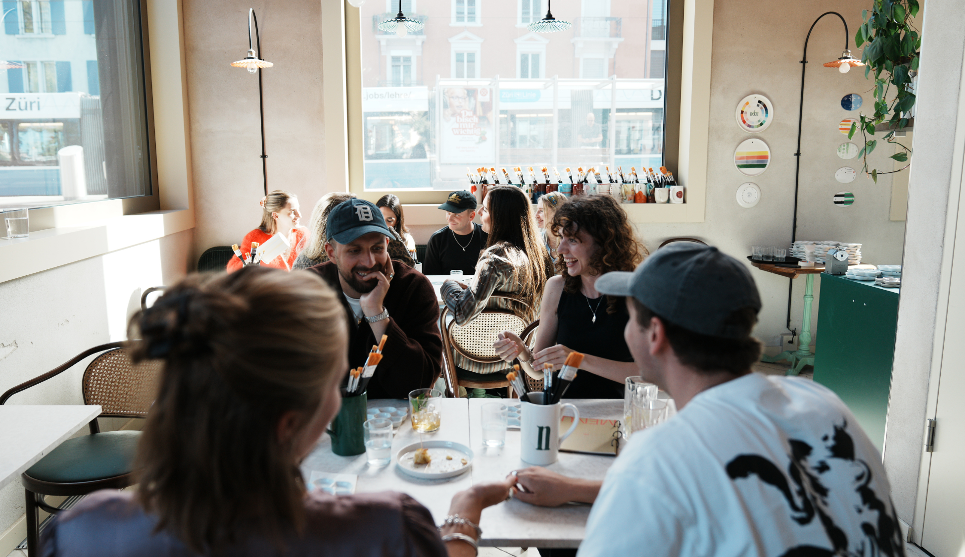 Team event at nebu creative bar Zurich with guests painting ceramics and enjoying drinks together