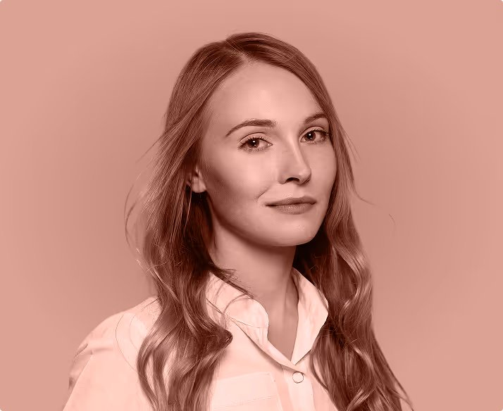 A young woman with long blonde hair on a pink background